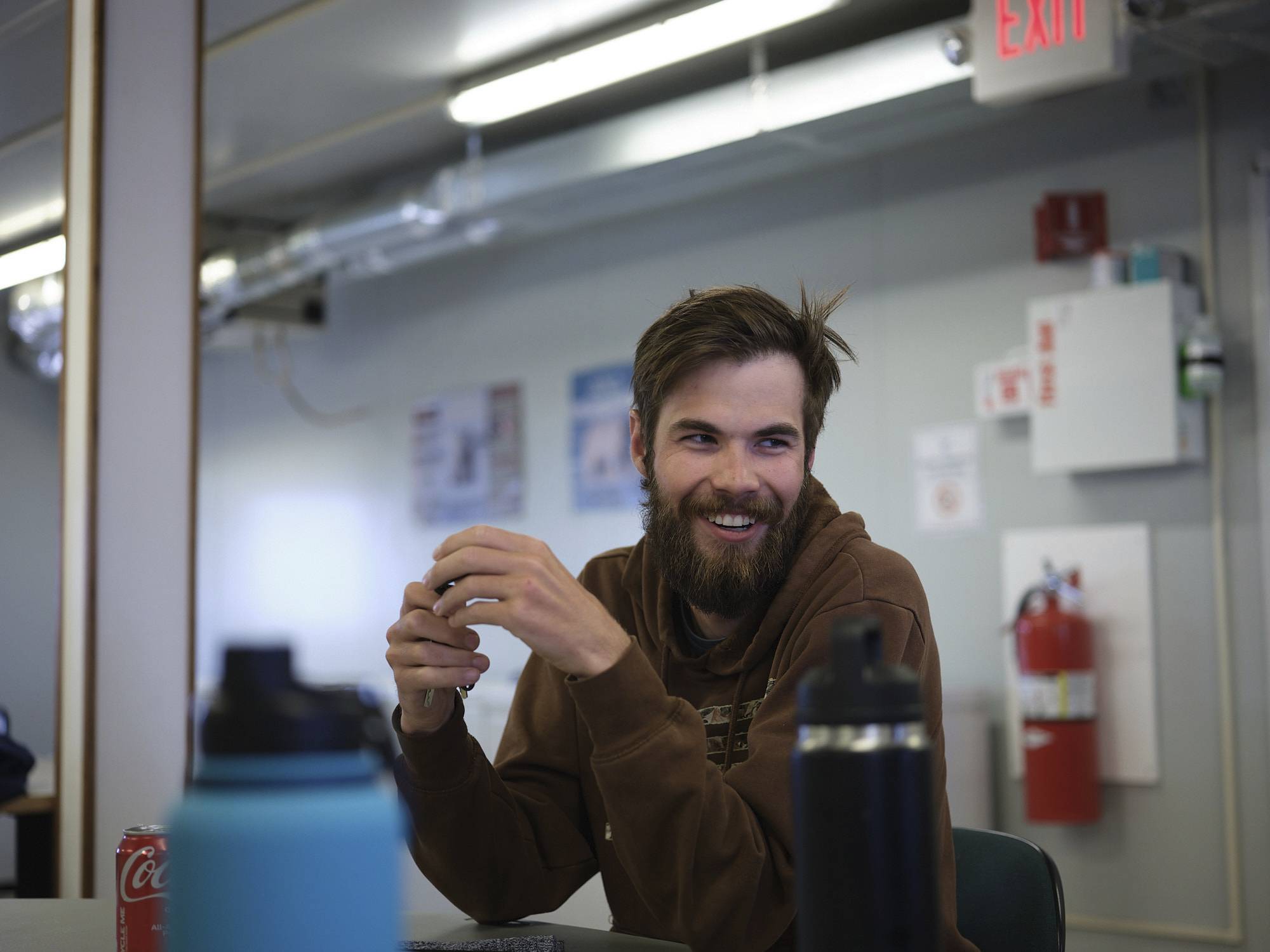 Taylor at the Nest. A man laughing at a table